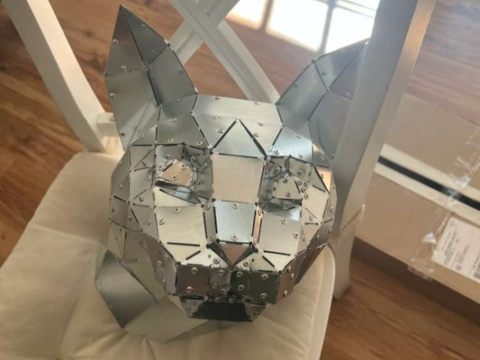 Low poly cat head in riveted galvanised sheet metal, a customer's build, blind rivets visible on every folded tab